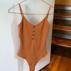 orange/tan bodysuit